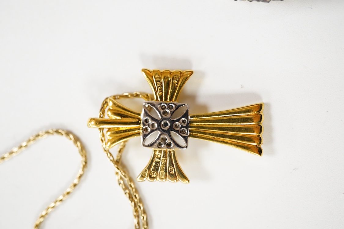 An 800 standard gilt white metal and garnet cluster set oval pendant, 18mm, on a 585 yellow metal fine link chain, 2.5 grams, a gilt white metal and garnet cluster set hinged bangle, two white metal brooches including on